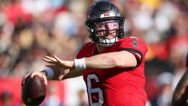 Buccaneers quarterback Baker Mayfield throws a pass in a game.